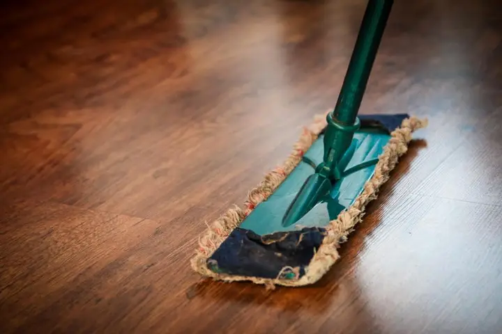 Mop cleaning a timber floor